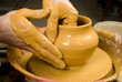 hands of a potter, creating an earthen jar on the circle hands of a potter, creating an earthen jar on the circle