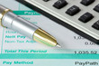 pen,calculator and payslip