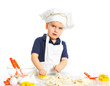Beautiful caucasian boy making a cake