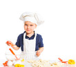 Beautiful caucasian boy making a cake