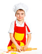 Beautiful caucasian boy making a cake