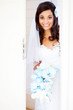 happy bride opening the door