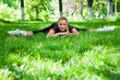 Beautiful teenage girl making exercises in the park in spring Beautiful teenage girl making exercises in the park in spring