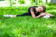 Beautiful teenage girl making exercises in the park in spring Beautiful teenage girl making exercises in the park in spring