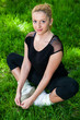 Beautiful teenage girl making exercises in the park in spring Beautiful teenage girl making exercises in the park in spring