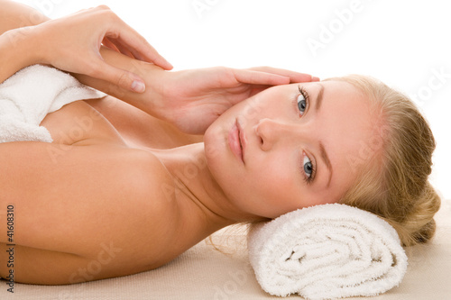 Photo: Woman on massage bed Woman on massage bed