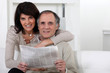Mature couple looking at a newspaper Mature couple looking at a newspaper