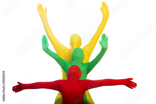 Photo: Three colorful people with arms outstretched Three colorful people with arms outstretched