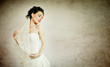 Portrait of a beautiful woman dressed as a bride isolated