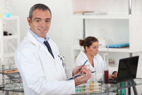 Photo: Two scientists in laboratory Two scientists in laboratory