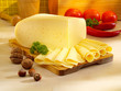 Ararangement with appetizing cheese on the kitchen table.