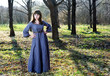 Photo: Young woman in vintage dress in the forest Young woman in vintage dress in the forest