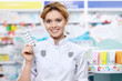 Photo: Pharmacist with tablets Pharmacist with tablets