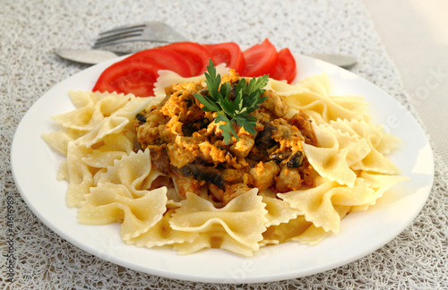 Photo: Farfalle with chicken fillet and mushrooms stew Farfalle with chicken fillet and mushrooms stew