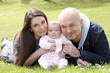 happy family together on grass