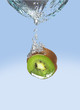 Kiwi slice dropped in water.