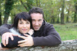 Happy couple strolling in the forest