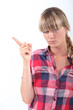 Scolding young woman wagging her finger
