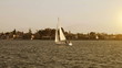 Sailing boat in the sea at sunset Sailing boat in the sea at sunset