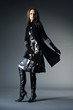 Beautiful fashion model with a bag posing Beautiful fashion model with a bag posing