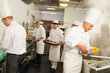 Professional kitchen busy team cooks and chef