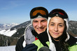 young couple and snowy mountains in background