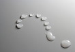 Water drops question mark on grey background
