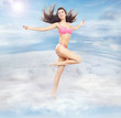 Conceptual photo of a cute brunette running in clouds Conceptual photo of a cute brunette running in clouds