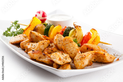 Photo: Grilled meat and vegetables on white background Grilled meat and vegetables on white background