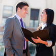 Close up of business couple outdoors..