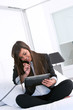 Young attractive business woman with tablet.