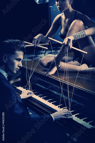 Photo: Seductive woman on the piano Seductive woman on the piano