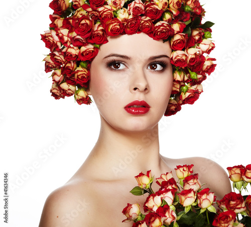 Photo: Portrait of young beautiful woman with rose in hair, on white ba Portrait of young beautiful woman with rose in hair, on white ba