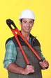 Laborer stood with bolt-cutters Laborer stood with bolt-cutters