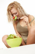 Woman with salad isolated on white