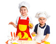Two beautiful caucasian brothers making a cake