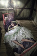 Foto: Beauty women in dress lying in the bed Beauty women in dress lying in the bed