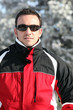 Man in a ski jacket and sunglasses