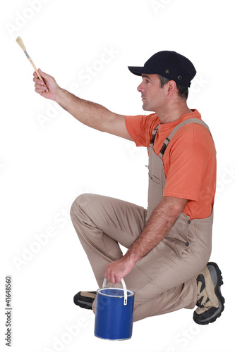 Photo: Man painting Man painting