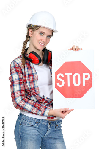 Photo: Woman holding stop sign Woman holding stop sign