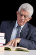 Senior businessman reading a book Senior businessman reading a book
