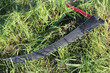scythe on grass