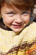 Little girl wearing jumper outdoors