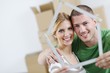 Young couple moving in new house