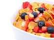Cornflakes with fresh fruits on white Cornflakes with fresh fruits on white