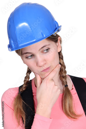Photo: portrait of female apprentice looking puzzled portrait of female apprentice looking puzzled