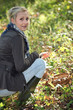 Woman picking mushrooms
