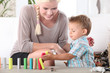 Little boy playing with building blocks