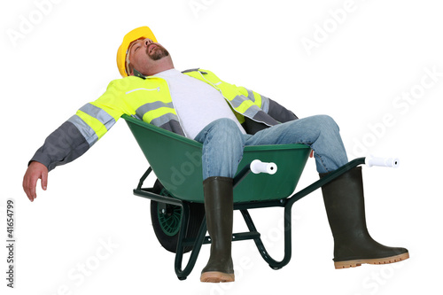 Photo: Tradesman asleep in a wheelbarrow Tradesman asleep in a wheelbarrow