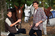 young boy and girl riding horses
